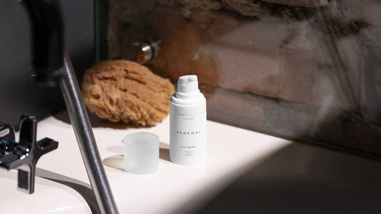 Velora Renewal Eye Cream on a bathroom sink